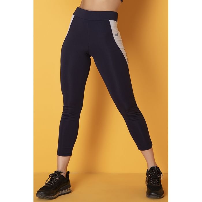 Clovia Snug Fit Active Tights in Navy with Reflective Sticker on White Panels - AB0042H08
Clovia Snug Fit Active Tights in Navy with Reflective Sticker on White Panels - AB0042H08