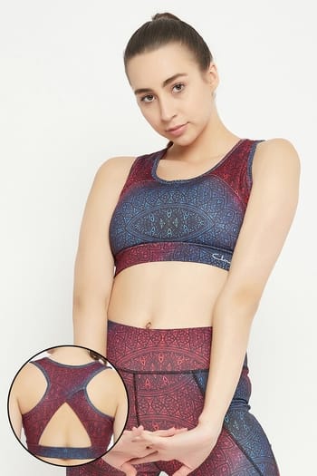 Clovia Medium Impact Padded Geometric Print Racerback Sports Bra in Maroon