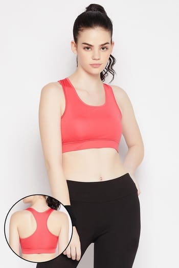 Clovia Medium Impact Padded Racerback Sports Bra in Coral Pink