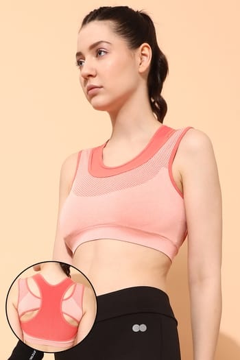 Clovia Medium Impact Padded Seamless Sports Bra in Peach Colour with Removable Cups