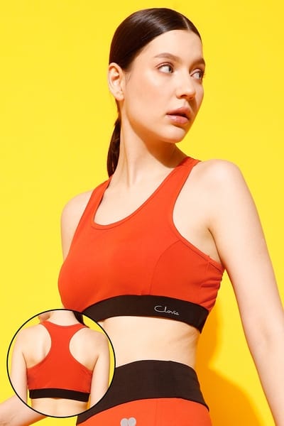 Clovia Medium Impact Padded Racerback Sports Bra in Rust Brown