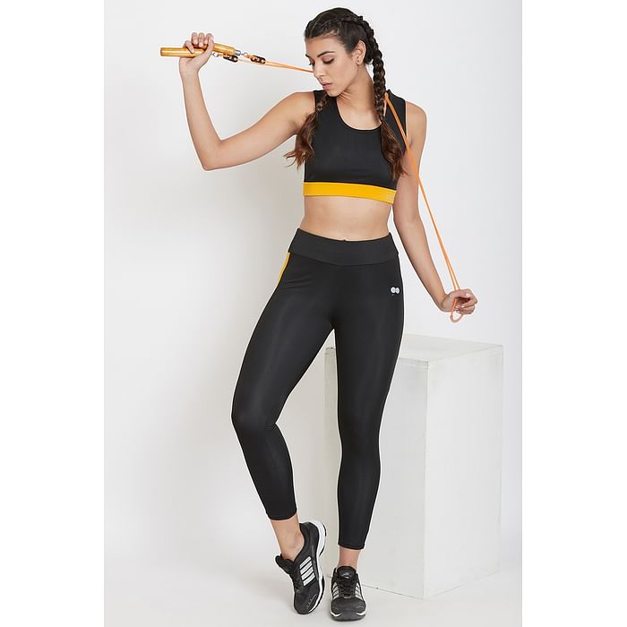 

Clovia Medium Impact Padded Sports Bra and Ankle Length Tights in Black - ASC043A13