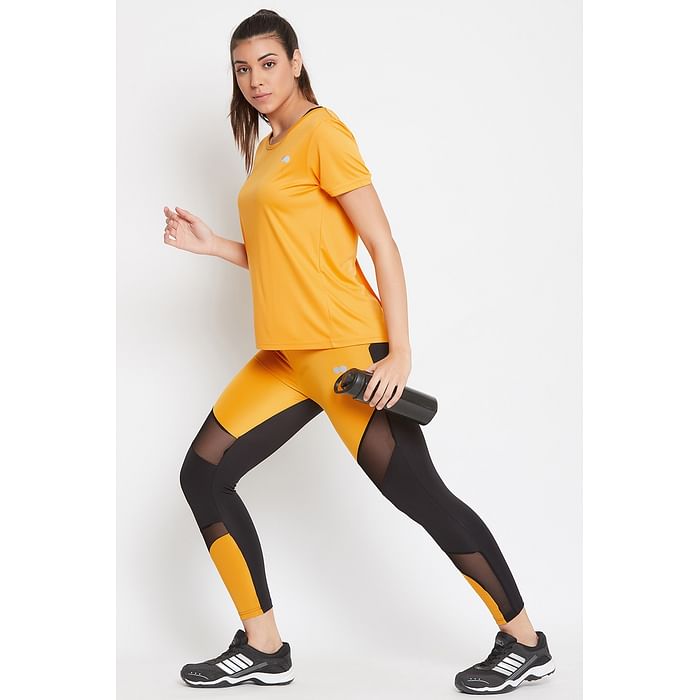 

Clovia Comfort Fit Active T-shirt & Snug Fit Active Colourblock Ankle-Length Tights in Mustard - ASC063P02, Light yellow