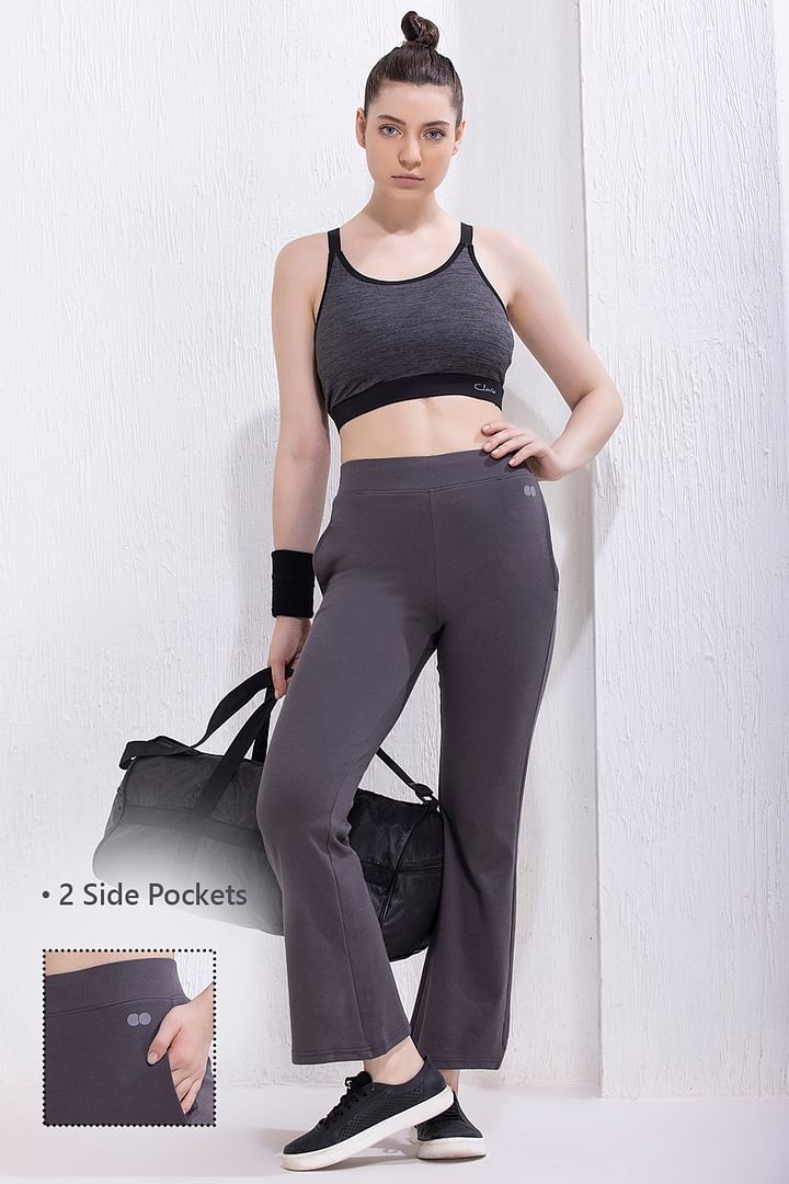 Clovia High Waist Flared Yoga Pants in Black with Side Pockets
