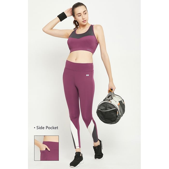 

Clovia Medium Impact Padded Colourblocked Racerback Sports Bra & Snug Fit High Rise Active Tights in Purple with Side Pocket - ASC048P15