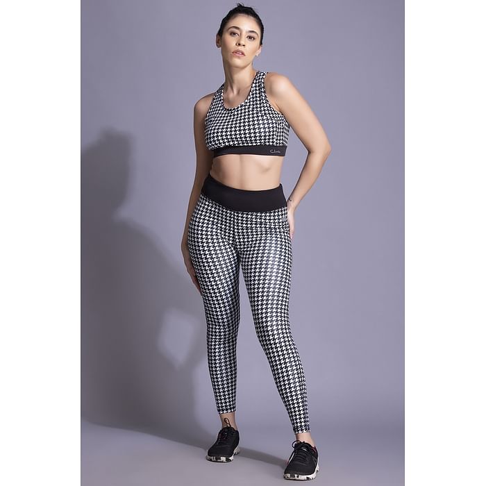 

Clovia Medium Impact Padded Sports Bra & Snug Fit High Rise Tights in Black with Houndstooth Print - ASC042C13