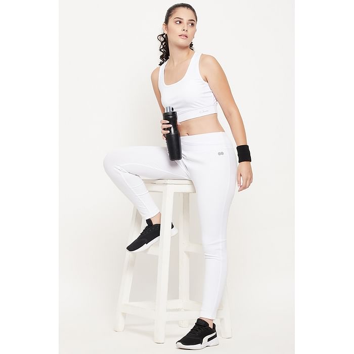 

Clovia Medium Impact Padded Non-Wired Sports Bra & Snug Fit Active Mid-Rise Tights in White - ASC074P18