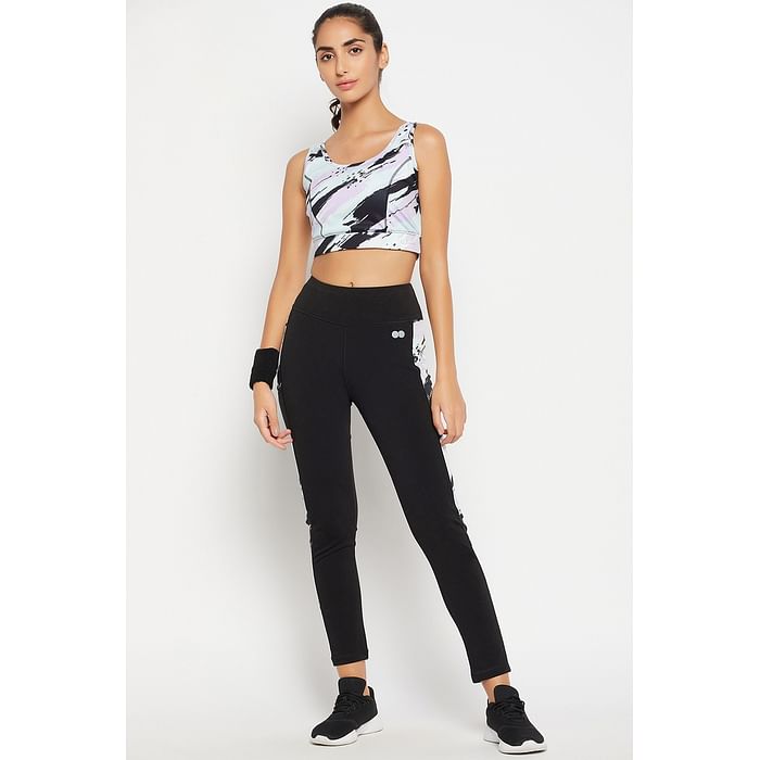 

Clovia Medium Impact Padded Printed Active Sports Bra in Sky Blue & High Rise Active Tights in Black with Printed Panels - ASC113R13