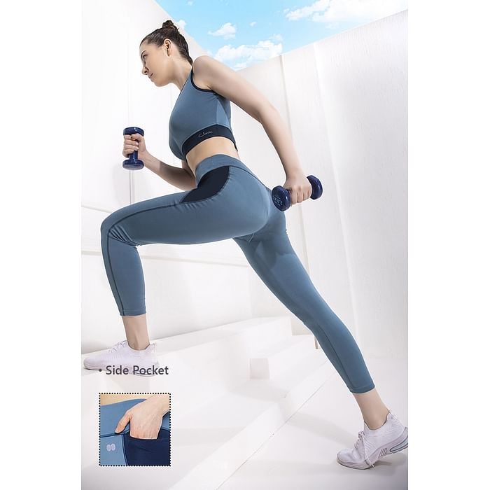 

Clovia Medium Impact Padded Sports Bra & Snug Fit Mid-Rise Ankle-Lenth Tight in Baby Blue - ASC057A03, Light blue