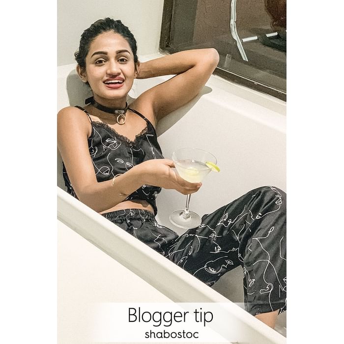 

Clovia Plush Satin Printed Top & Pyjama Set in Black - NS1213P13